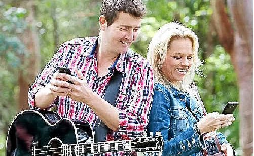 Muster stars Adam Harvey and Beccy Cole using the Gympie Muster’s new Optus Mobi-site. Muster stars Adam Harvey and Beccy Cole using the Gympie Muster’s new Optus Mobi-site.